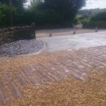 granite flooring and artificial sleepers and black tarmac driveway
