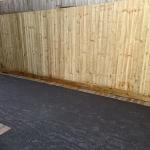 Black Tarmac Driveway after with fencing