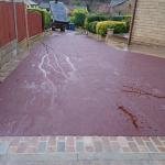 red tarmac drive after view from garage