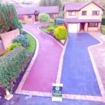 red and black tarmac drive indian stone border close up