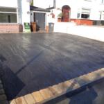 black tarmac drive with with Indian stone setts border